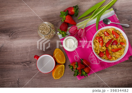 Healthy breakfast cornflakes with milk and fruits Healthy breakfast cornflakes with milk and fruits 39834482
