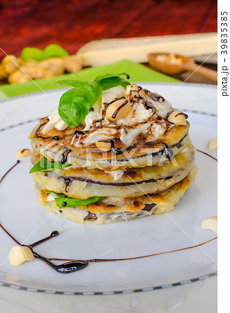 Grilled eggplant with feta cheese,parmesan basil, nuts Grilled eggplant with feta cheese,parmesan basil, nuts 39835385