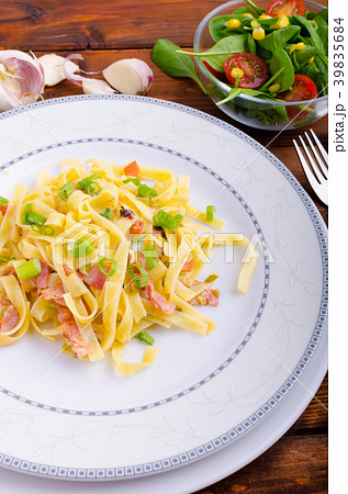 Italian pasta with spring onion and bacon 39835684