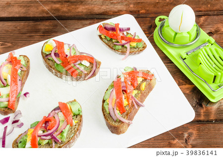 Brown bread with avocado, smoked salmon, boiled egg Brown bread with avocado, smoked salmon, boiled egg 39836141