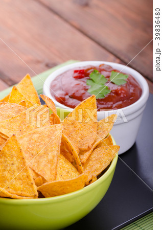 Tortilla chips with spicy tomato salsa Tortilla chips with spicy tomato salsa 39836480