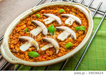 Chicken baked with rice, mushrooms and tomatoes Chicken baked with rice, mushrooms and tomatoes 39836624