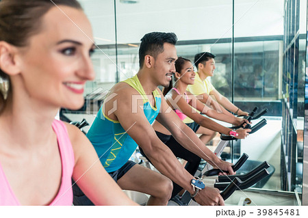 Beautiful fit woman smiling during workout at Beautiful fit woman smiling during workout at 39845481