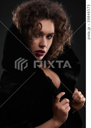Portrait of passionate curly girl posing in black Portrait of passionate curly girl posing in black 39846573