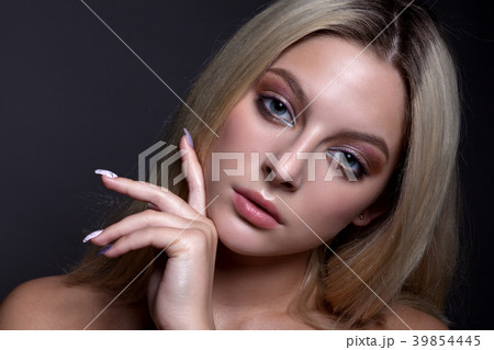 Portrait of a beautiful girl with makeup and hair Portrait of a beautiful girl with makeup and hair 39854445