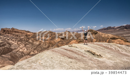 Death Valley and a happy hiker 39854473