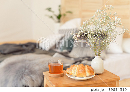 Morning breakfast on wooden tray near bed Morning breakfast on wooden tray near bed 39854519