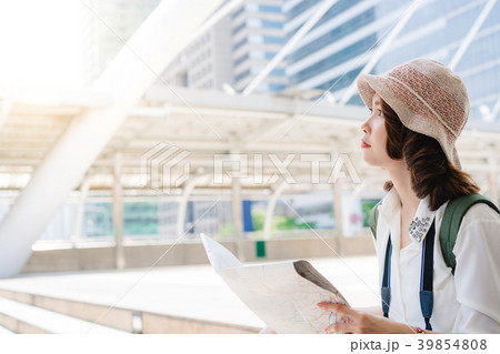 Happy Asian woman traveler tourist wanderer. Happy Asian woman traveler tourist wanderer. 39854808