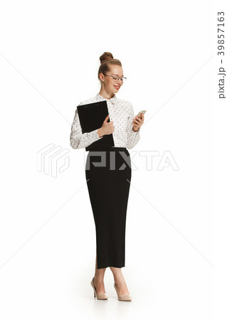 Full length portrait of a smiling female teacher Full length portrait of a smiling female teacher 39857163
