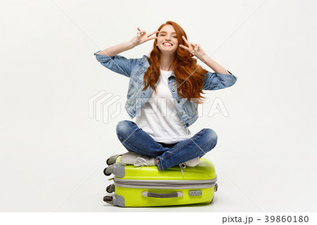 Travel concept: young smiling caucasian woman 39860180