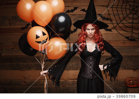 Halloween Witch Concept - Beautiful caucasian Halloween Witch Concept - Beautiful caucasian 39860709