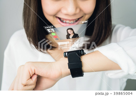 Woman in a white dress show digital clock display. 39865004