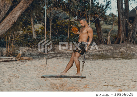 Handsome man standing on the swing with pandan 39866029