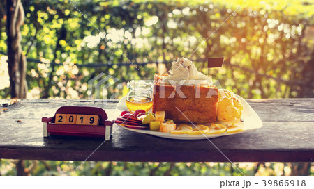 Honey Toast on Wooden counter with number 2019. 39866918