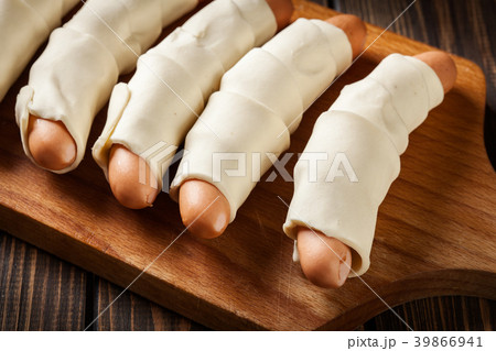 Preparation for baking sausage in puff pastry Preparation for baking sausage in puff pastry 39866941