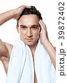 Portrait of handsome man toweling isolated. 39872402