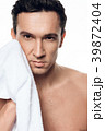 Portrait of handsome man toweling isolated.  39872404