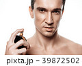 Handsome man using perfume isolated. Beauty man  39872502