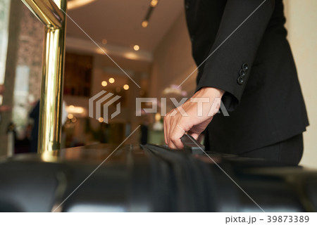 Helping with luggage Helping with luggage 39873389