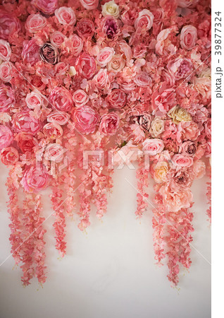 Flower garland on the wall. Dense wall of flowers 39877324