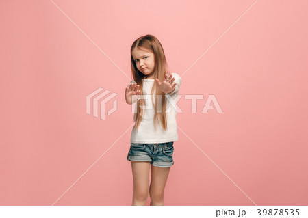 Doubtful pensive teen girl rejecting something 39878535