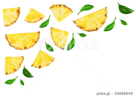Sliced pineapple decorated with green leaves 39886649