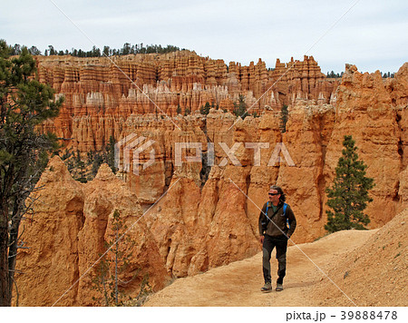Hiker on a trail in Bryce Canyon National Park Hiker on a trail in Bryce Canyon National Park 39888478