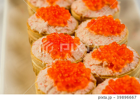 Tartlets with cheese and red caviar. Selective 39896667