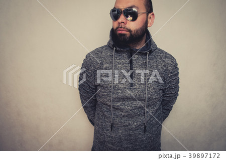 Handsome young man in sunglasses. 39897172