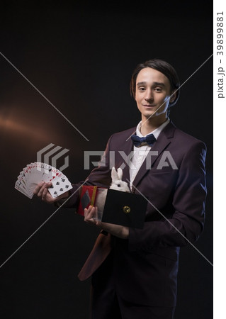 Handsome man showing tricks in the dark Handsome man showing tricks in the dark 39899881