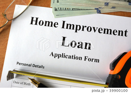 Home improvement loan form on a wooden table. Home improvement loan form on a wooden table. 39900100