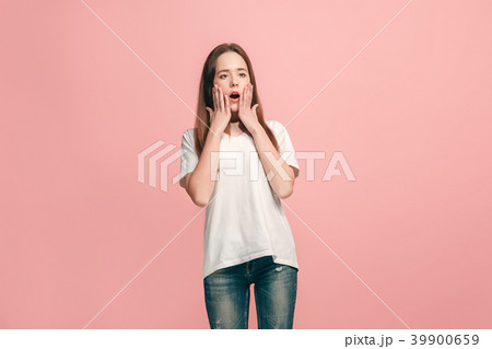 Beautiful teen girl looking suprised isolated on 39900659