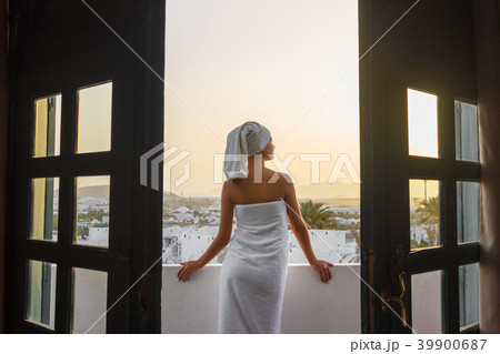 girl on terrace looks at the sunset in mountains girl on terrace looks at the sunset in mountains 39900687