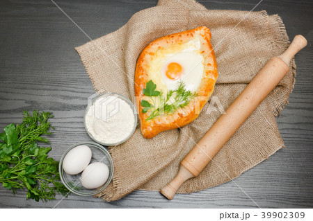 Georgian cuisine. Khachapuri on sackcloth, flour 39902309