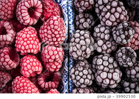 Frozen blackberry and raspberry fruits, close up Frozen blackberry and raspberry fruits, close up 39902530
