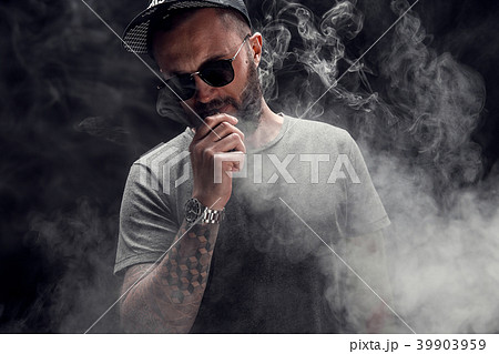bearded male dressed in a grey shirt, sunglasses bearded male dressed in a grey shirt, sunglasses 39903959
