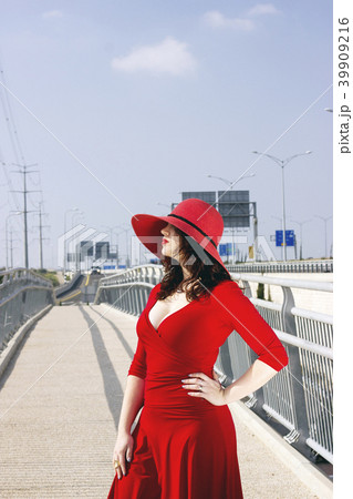 Full length portrait of fashion woman in red dress 39909216