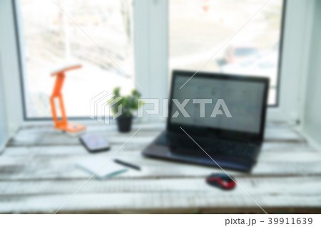 Laptop on the wood table . 39911639