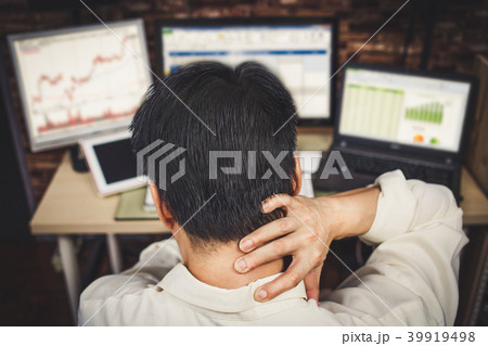 asian men stressful working with computer 39919498