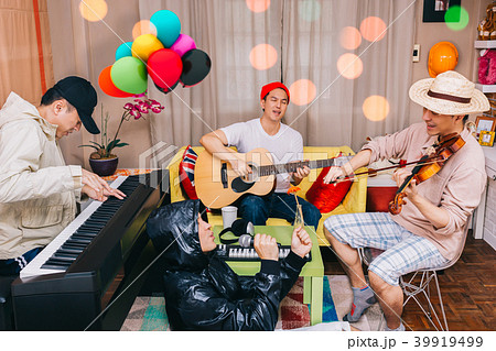 happy family playing music together in party 39919499