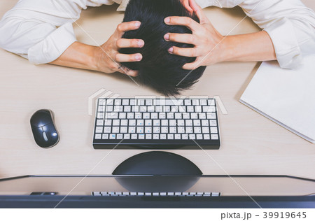 Tired & headache asian businessman work overtime Tired & headache asian businessman work overtime 39919645