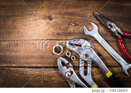 old & grunge set of hand tools on wood floor 39919664