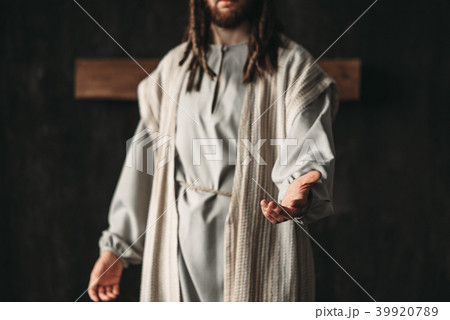 Man in the image of Christ reaching out his hand Man in the image of Christ reaching out his hand 39920789