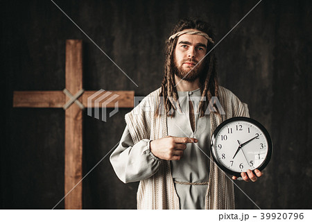 Man in the image of Jesus Christ shows on clock Man in the image of Jesus Christ shows on clock 39920796