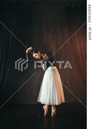 Classical ballet dancer in motion on the stage 39920898