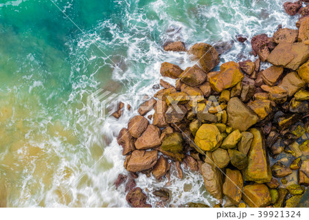 Top aerial view of blue waves crashing on shore 39921324
