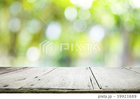 Wooden table with blur background of nature forest Wooden table with blur background of nature forest 39921689