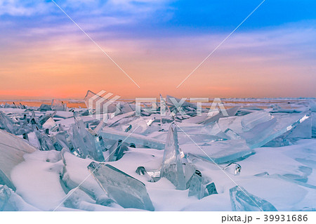 Cracking Ice in Baikal water lake with sunrise Cracking Ice in Baikal water lake with sunrise 39931686