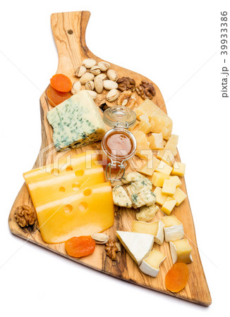 various types of cheese - brie, camembert, roquefort and cheddar on wooden board various types of cheese - brie, camembert, roquefort and cheddar on wooden board 39933386