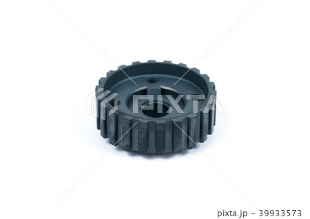 Close-up of a crankshaft gear on an isolated white background. New spare parts Close-up of a crankshaft gear on an isolated white background. New spare parts 39933573